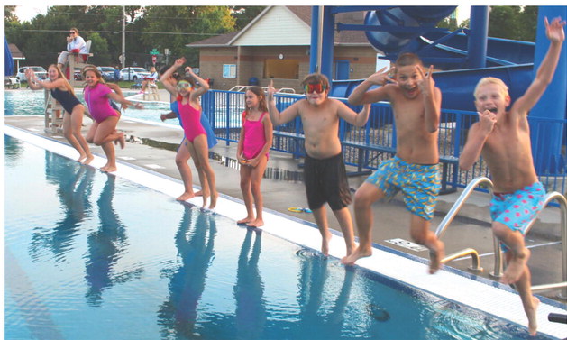 Dozens of local children dove in for one last swim on the last day of Webster pool’s 2026 season Aug. 13. From left to right: Karley Lone, Lydia Petersek, Brooklyn Bohnenkamp, Lyric Cyrus, Calliope Cyrus, Reagan Thompson, Dylan Ellis, Hunter Swenson and Tucker Franson. Seated in the background is lifeguard Josie Spiering. Reporter &amp; Farmer | Timothy Gibson