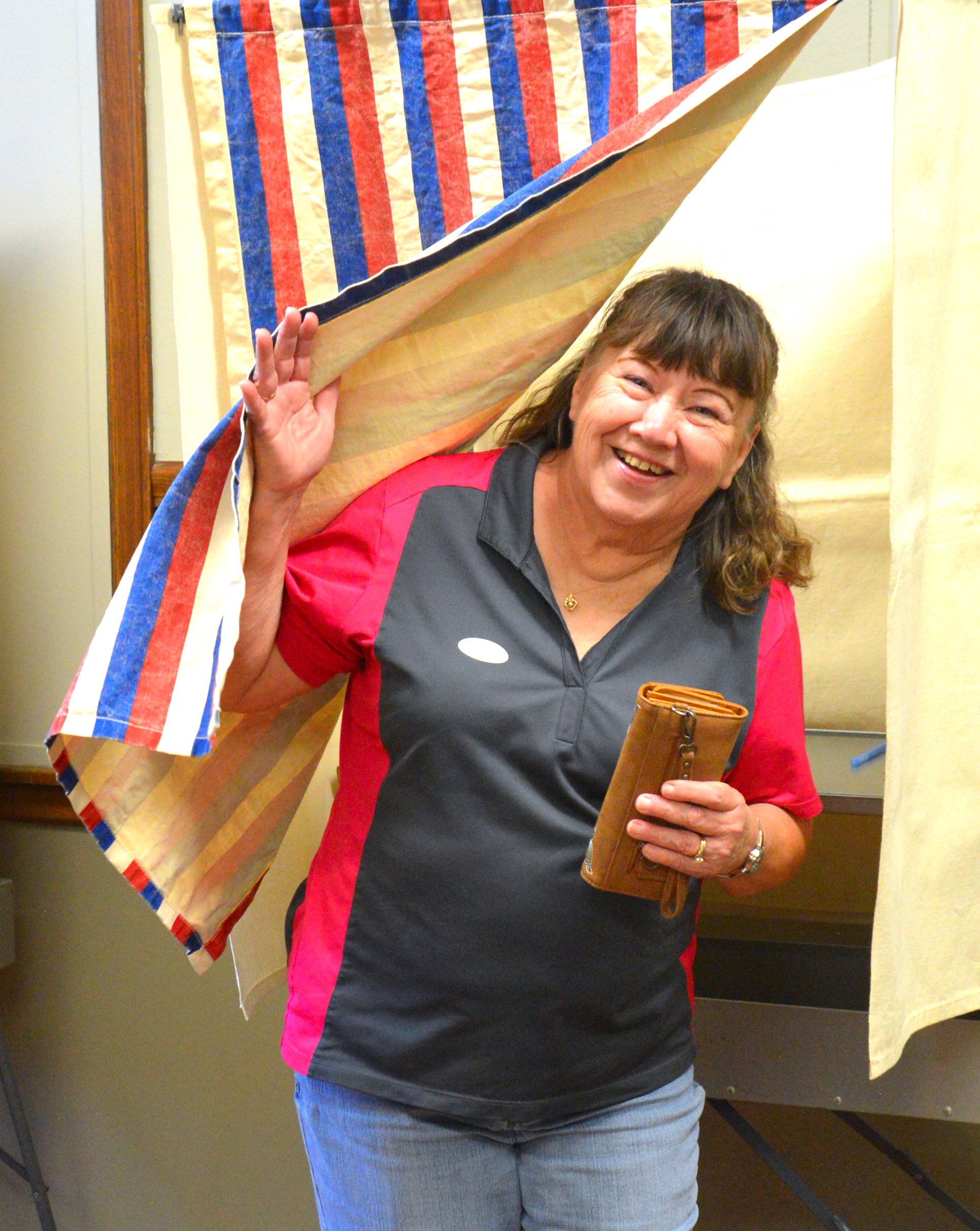 Webster resident Marcia Solberg exits a voting booth after casting her ballot at Webster City Hall on primary election day June 2.