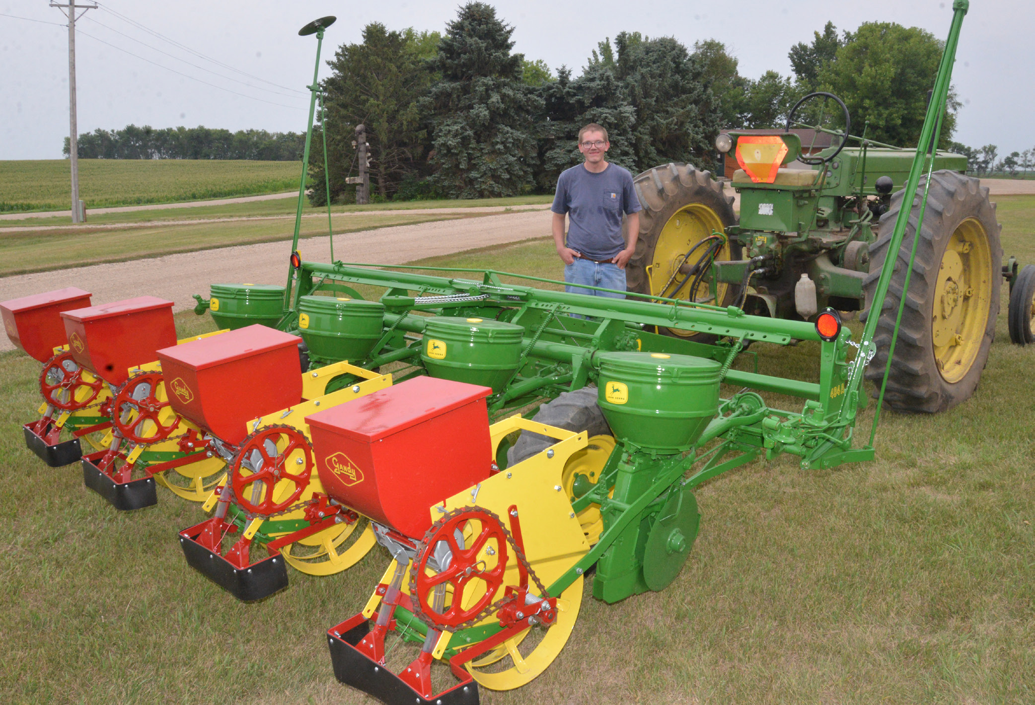 Fourth-generation Day County farmer Scott Hughes shows off his early ‘60s John Deere planter. Hughes completed the vintage planter’s restoration this June, a project he undertook after discovering the long-lost implement once belonged to his great-grandfather. Reporter &amp; Farmer | Timothy Gibson