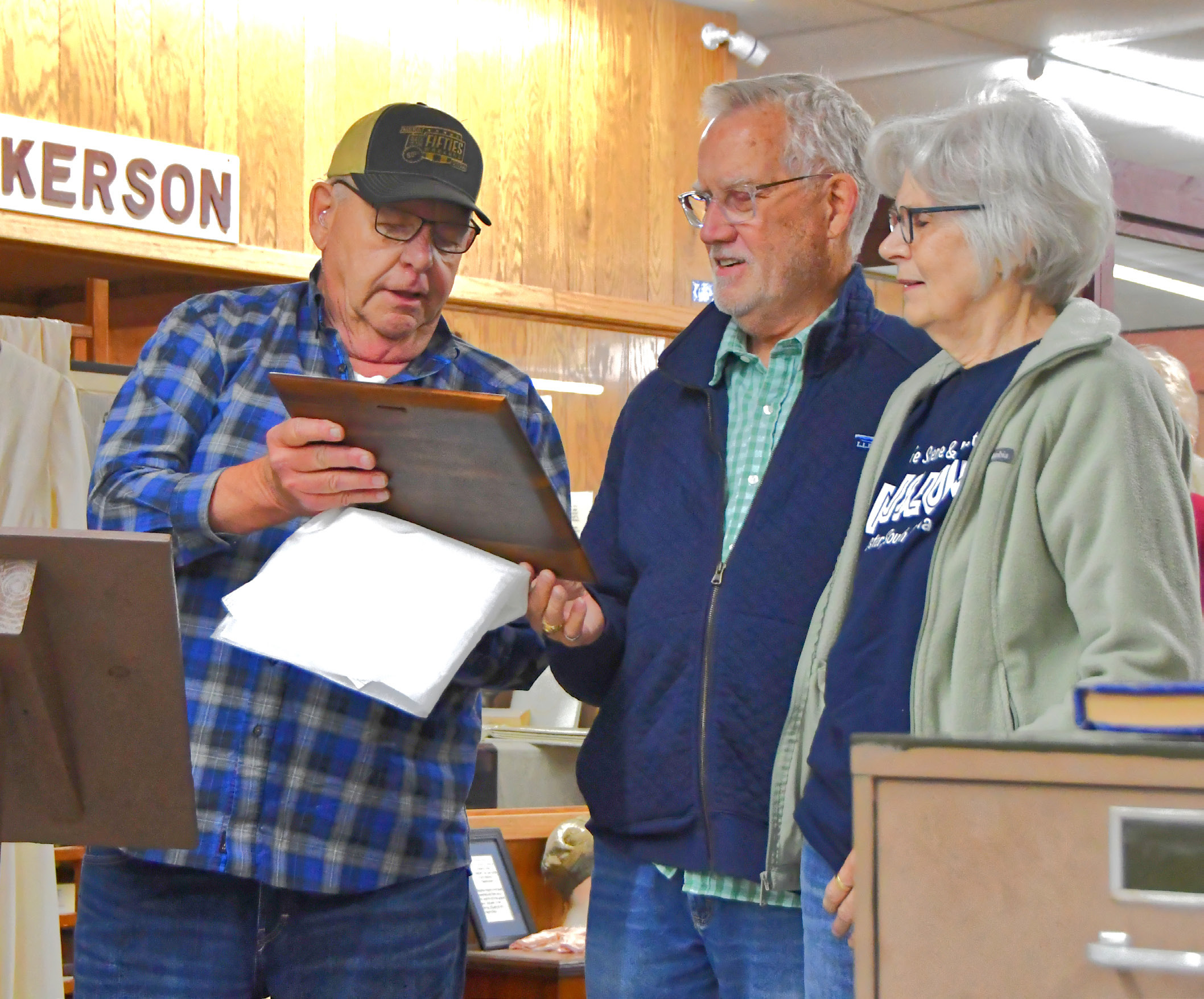 At the grand opening of the Museum of Wildlife, Science &amp; Industry June 13, Jim Brakefield announced the new library named after Monte and Fran Rougemont. From left, Brakefield can be seen surprising Rougemonts with the announcement of the new expansion. Reporter &amp; Farmer | Connor Handrahan
