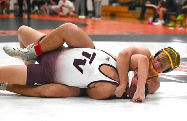 Gage Baumgarn of Webster Area gets his opponent in a hold during the Ken Ruml Tournament in Howard Dec. 13. Baumgarn finished fourth in the 165 weight class with a record of 3-2. Reporter &amp;amp; Farmer | Brianna Jorgenson, Captured Creations Photography
