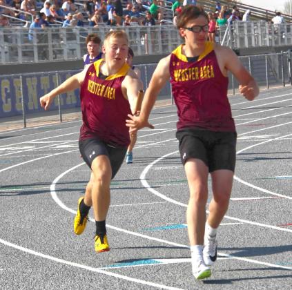 Isaac Nelson hands the baton off to Jeron McCreary during the 4x200 relay at the Al Sahli Invite in Aberdeen May 9. The boy’s team placed eighth with a time of 1:39.36. Reporter &amp;amp; Farmer | Subscriber snapshot