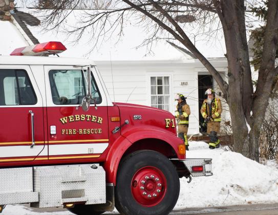 Webster Fire Department responded to a small house fire at 1015 Main St. Dec. 6. The fire was caused by an electrical heater in the home. No injuries or serious damage resulted. Here, firefighters Allan Jaspers and Wes Hoven walk out of the home after evaluating the scene. Reporter &amp;amp; Farmer | Brenner Cariveau