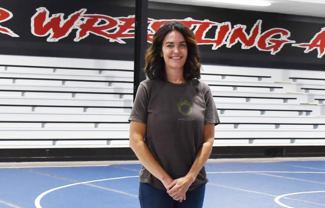 Part owner and founder of Sniper Wrestling Academy Kara Pharis stands in the newly renovated wrestling room which was once the Bristol school gym. Reporter &amp;amp; Farmer | Annie Witt