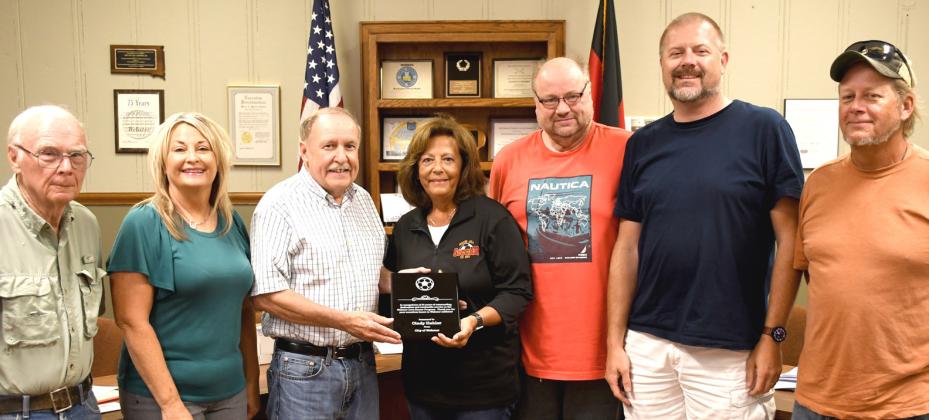 Cindy Hahler was presented an award during Webster City Council’s Aug. 10 regular meeting for her 31 years of dedication to the Webster youth soccer program. Pictured from left are council members Wayne Klungseth, Stacy Mount, Mayor Mike Grosek, Hahler, council members Brian Vogl, Derek Sinner and Toni Brown. Reporter &amp; Farmer | Amanda Dulitz