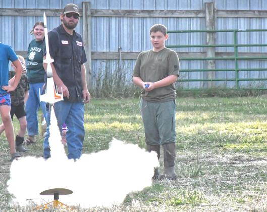 Day County Fair started Aug. 5 and continued throughout the weekend until Aug 9. To kick off the fair, Day County youth launched their rockets and spent the evening watching their creations reach the skies. From left, Kelsey Fischer watches Connor Fischer help Abel Bloom launch one of their bigger rockets. Reporter &amp;amp; Farmer | Connor Handrahan