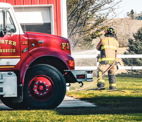 Jeff Smidt of Webster Fire Department hoses down the outside of a detached garage at 14074 SD Hwy. 12 near Webster after an electrical fire broke out Oct. 23. Assistant fire chief Eric Kwasniewski reported there was no one injured in the fire and no major structural damage was sustained to the building.