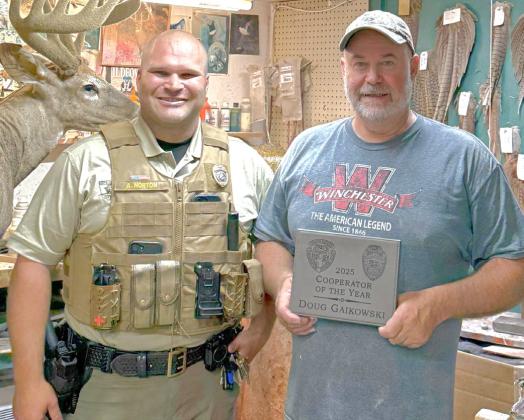 Doug Gaikowski, at right, was presented the Cooperative of the Year award by Austin Norton, left, Aug. 15. Gaikowski is a long time Webster taxidermist who has worked with South Dakota Game, Fish &amp; Parks and South Dakota Association of Conservation Districts by testifying in front of state legislature in order to help the industry. Reporter &amp; Farmer | Subscriber snapshot
