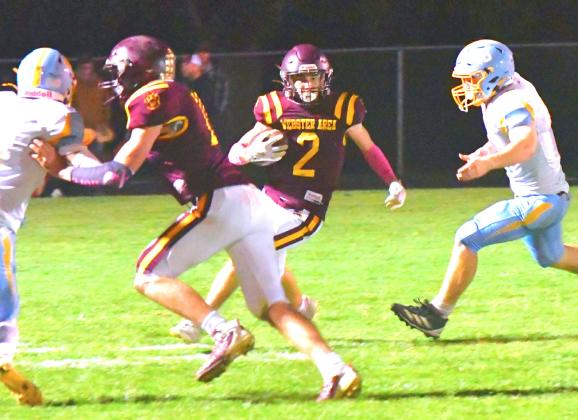 Webster Area Bearcats football took a hard loss against Hamlin Chargers during their home game Oct. 2. Bearcats tried their best to fight back, but Hamlin forced a 50 point mercy rule during the third quarter. Here, Gabriel Gaikowski runs for a first down with Aiden Gaikowski clearing a path for him. Reporter &amp; Farmer | Connor Handrahan