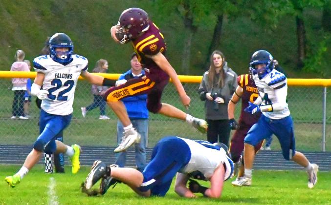 Webster Area Bearcats had their first win of the season against Florence/Henry for their homecoming game Sept. 25. Here, Hudson Lesnar catches an interception and jumps over a defender. Reporter &amp; Farmer | Connor Handrahan