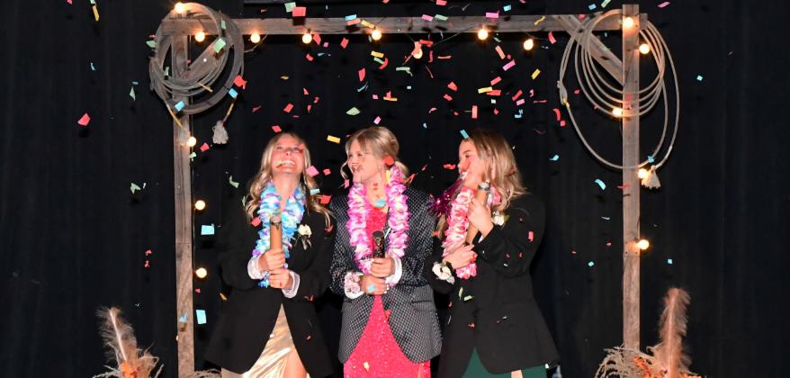 Waubay prom goers, Jersey Johnson 11th grade, Kayce Berger 11th grade and Addison Bronson ninth grade, pop confetti canons as part of the festivities at Waubay’s prom April 25. Reporter &amp;amp; Farmer | Leyton Beardslee