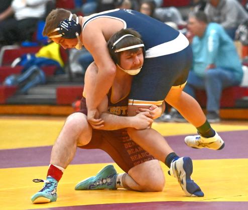 Matthew Angiolelli of Webster Area Bearcats lifts his opponent during the Webster Holiday Tournament Jan. 3 at Webster Armory. Angiolelli placed third in the 215 weight class with a record of 3-1. Reporter &amp;amp; Farmer | Brianna Jorgenson, Captured Creations Photography