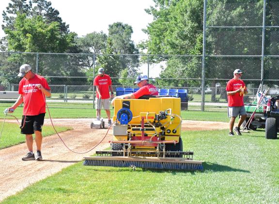 With 22 games being played within six days, the Webster baseball complex needs to be properly maintained, that’s where the grounds crew comes. in. From left, Wade Rausch, Devin Pederson, Kevin Schimmel and Brian Lux can be seen applying fresh chalk for the third baseline. Reporter &amp; Farmer | Connor Handrahan