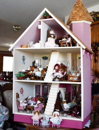 A major focal point of Anna May Carlis’ doll collection includes a hand crafted doll house which her late husband Glenn created for her. Inside the house includes porcelain dolls and mini furniture across three levels. Reporter &amp;amp; Farmer | Brenner Cariveau