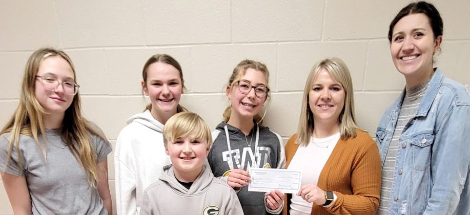Webster Area Student Council members, front Barrett Bloom, fourth grade; back, from left, eighth graders Claire Halvorson, Sophia Wilson and Remi Hubsch presented a $1,000 check to playground committee members Vanessa Bloom, fifth grade teacher and Emily Wagner, second grade teacher. Funds were raised through last fall’s Driven Coffee fundraiser and will support the new playground and gym floor project. Reporter &amp;amp; Farmer | Subscriber snapshot