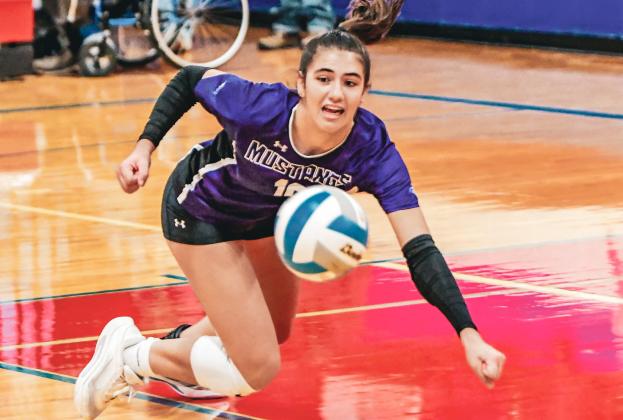 Addison Heinje dives for the ball during Waubay/Summit’s Class B Region 1 quarterfinal match against Hitchcock-Tulare Nov. 4 in Tulare. Mustangs fell 0-3 with set scores of 9-25, 14-25 and 14-25. Reporter &amp;amp; Farmer | Leyton Beardslee