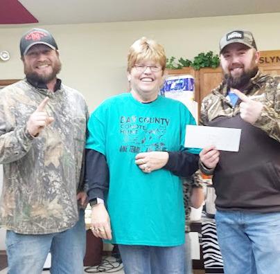In Roslyn the 18th annual coyote hunt organized by Patti Mitchell took place Dec. 13-15. During the competiton, 74 total coyotes were harvested. Here from left, Adam Imberi from Clark stands next to Mitchell and his teammate Dominic Plunkott from Watertown as they are handed their check worth $1,500. As a team Imberi and Plunkott harvested 21 coyotes. Reporter &amp;amp; Farmer | Subscriber Snapshot