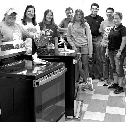 Webster business owner helps 4-H program get new ovens