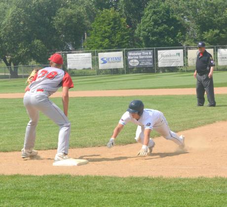 Webster Post 40 competed in the Legion Region tournament July 21-22. This was Post 40’s first game of the tournament and they played against Britton Lumberjacks. Here, Chase Gregerson can be seen sliding into first after almost getting picked off at first. Reporter &amp; Farmer | Connor Handrahan