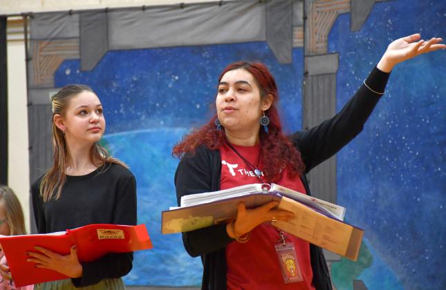 Webster Area middle schooler Taylee Cyrus, left, watches Theatre 605 director Noelle Hall during a rehearsal March 11 for their production at Webster Area School. After a week of auditions and rehearsals their musical performance of Space Pirates was held March 13 with Cyrus performing as the character Casey. Reporter &amp;amp; Farmer | Leyton Beardslee