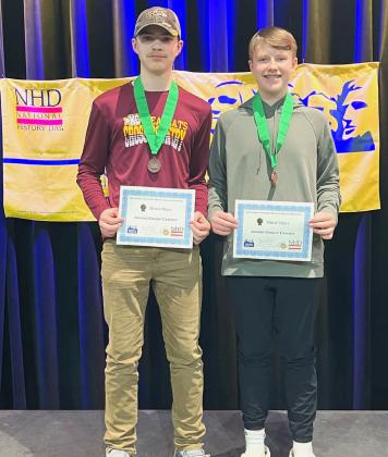 Jase Voss and Jackson Baumgarn show off the certificates they received, noting their attendance of the nationl event in June. Reporter &amp;amp; Farmer | Subscriber snapshot