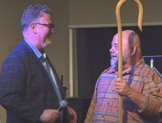 Drew Becker, left, Superintendent of the South Dakota Ministry Network of the Assemblies of God, presented Pastor Clark Audiss, right, with a ceremonial shepherd’s staff at Freedom Church service Sept. 27 in Webster. The ceremony marked Audiss’s progression from campus pastor to lead pastor and the church’s transition to a standalone general council church. Reporter &amp; Farmer | Subscriber Snapshot