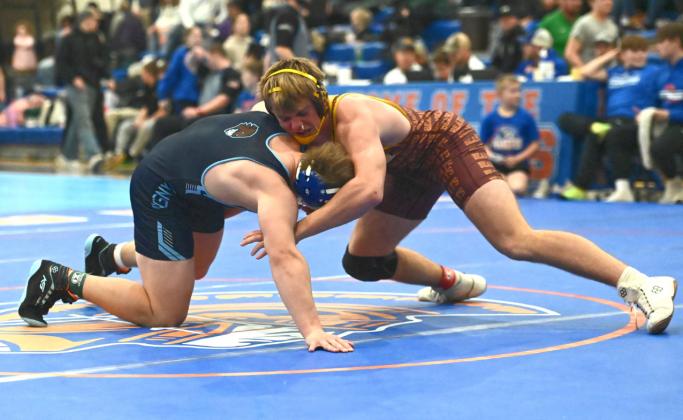 Gage Baumgarn of Webster Area Bearcats works to take down his opponent during the Parkston Little B wrestling tournament Jan. 24 in Parkston. Baumgarn placed second in the 190 weight class with a record of 3-1 and scored 22 team points. Reporter &amp;amp; Farmer | Brianna Jorgenson, Captured Creations Photography