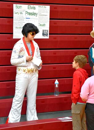 Grant Hauck gives his best Elvis impression as part of a wax museum event by Webster Area Elementary students at the Webster Armory May 2. Students dressed up as historical figures and gave presentations on their significance to those who attended. Reporter &amp;amp; Farmer | Leyton Beardslee