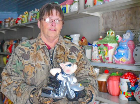 Patti Mitchell holds one of her approximately 6,000 cookie jars in her future museum in Roslyn Dec. 6. Mitchell said she has been collecting for 30 years is hopeful the museum will open to the public in May 2026. Reporter &amp;amp; Farmer | Leyton Beardslee