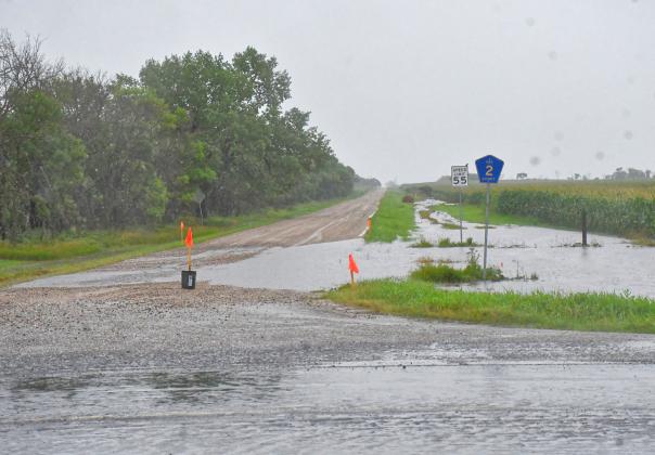 Day County was hit with flash flooding July 30. Many roads and fields along South Dakota Hwy. 27 were under several inches of water and were completely undriveable. Here, part of SD Hwy. 27 and 126th St. is under water and water from an adjacent field overflows onto the highway and street. Reporter &amp; Farmer | Connor Handrahan