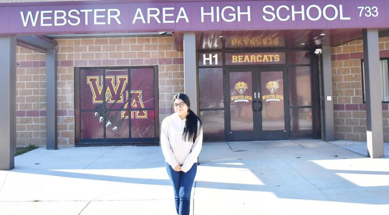 Webster Area High School foreign exchance student Azucena Murrillo from Madrid, Spain, stands in front of the Webster Area High School entrance Nov. 5. Reporter &amp;amp; Farmer | Brenner Cariveau