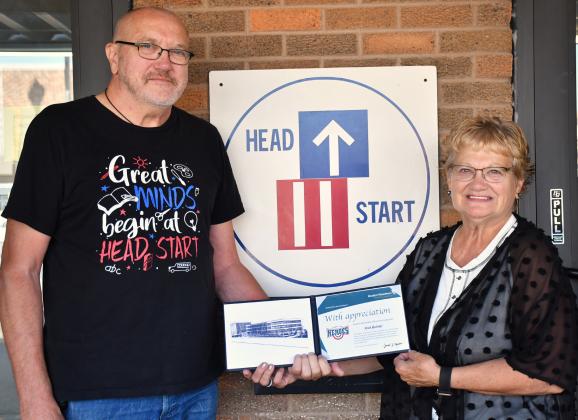 Rick Buhler, left, received the Modern Woodmen hometown hero award for his near 11 years of volunteering at the Webster NESD Head Start Center. The award was presented last week by Bernie Kurkowski, right. Buhler began volunteering at the child care non-profit in early 2015 after retiring. See full story on page 1. Reporter &amp;amp; Farmer | Leyton Beardslee