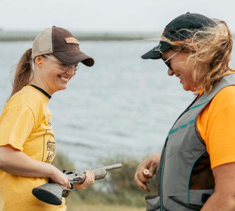 New hunter Lyndsay Krueger, Mason City, IA takes instruction from Sandy Austin at the women’s pheasant hunting workshop. Reporter &amp;amp; Farmer | photo by Nina Hoekstra @in.ninas.nature