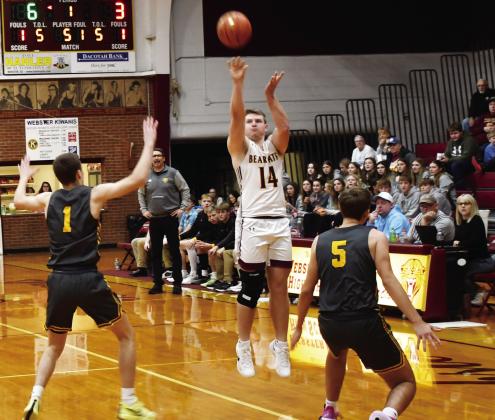 Webster Area Bearcats hosted Groton Area Tigers Dec. 30 in a contest the Bearcats lost 46-76. Here, Matthew Mount (14) attempts a three over Groton Area defenders Keegen Tracy (1) and Becker Busma (5). Reporter &amp;amp; Farmer | Brenner Cariveau
