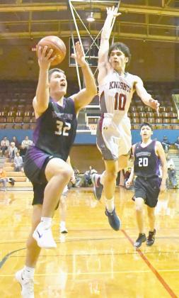 Waubay-Summit boys faced Aberdeen Christian Knights on the road with a spot in the SODAK16 up for grabs March 8 which ended in a 22-49 Mustangs loss. Here, Tripp Gaikowski (32) attempts a layup with Aberdeen Christian’s Raymond Rodriguez-Martinez (10) leaping in the air to block the shot as Newton Campell (20), trail behind. Reporter &amp;amp; Farmer | Brenner Cariveau