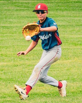 Bennett Kuecker of Webster VFW Post 4690 Teeners snags a ball in left field during Webster’s 1-8 loss against Flandreau July 30 at Bob Wiley Field in Webster. Teeners rebounded the next game of the series with a 24-16 win which sends them to the State Tournament in Volga. Reporter &amp;amp; Farmer | Leyton Beardslee