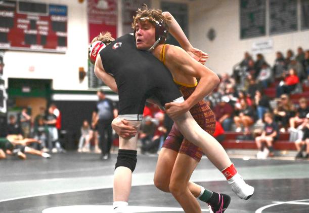 Tayten Kurkowski lifts up his opponent during a match at the Northeast Conference Tournament Dec. 19 in Clark. Kurkowski placed second in the 126 weight class with a record of 1-1. Reporter &amp;amp; Farmer | Brianna Jorgenson, Captured Creations Photography