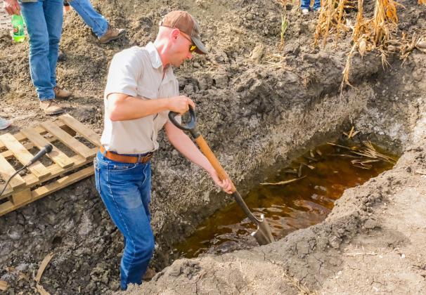 South Dakota state soil health specialist Kent Vlieger shows the water table and salinity level of the soil in a field south of Andover Sept. 29. The area falls in the James River Valley region which since the 1990s has seen an increase in saline affected soil. Reporter &amp;amp; Farmer | Leyton Beardslee