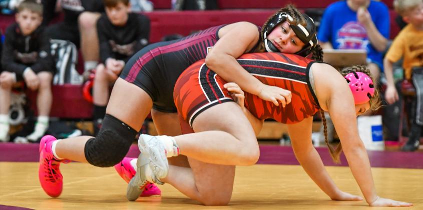 Jocelyn Rumpca of Webster gets a grip on Taylor Brown of Deuel/Deubrook Area during their match in a dual meet held at Webster Armory Jan. 13. Rumpca won the match by fall in 1:10. Reporter &amp;amp; Farmer | Leyton Beardslee