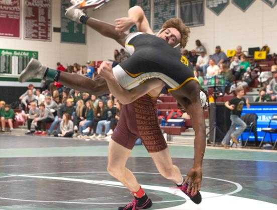 Webster Area wrestler Haeden Jorgenson picks up his opponent during the Clark/ Willow Lake WBC Invitational Dec. 6 in Clark. Jorgenson finished first in the 150 weight class with a record of 3-0. Reporter &amp;amp; Farmer | Brianna Jorgenson, Captured Creations Photography