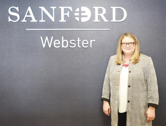 Melissa Cunningham was hired as the new CEO for Sanford Health and Bethesda Home in Webster Nov. 4. Here, Cunningham stands next to the Sanford sign in the clinic. Reporter &amp;amp; Farmer | Brenner Cariveau