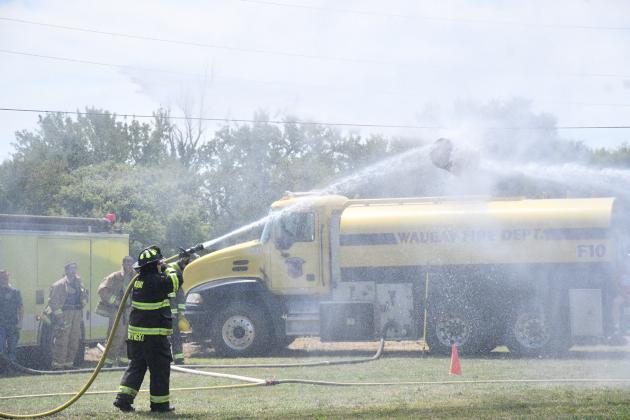 The annual Waubay Fun Fest had another successsful year and one of the crowd’s favorite activities was the fire fighter water fight. Here, Tim Gaikowski can seen fighting a close battle as he tries to push the keg to the other team’s side.