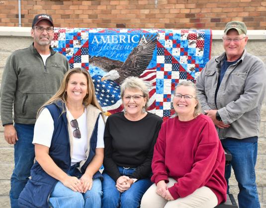 Some of the Roslyn Area Veterans Memorial commitee members pose in the partially completed park Nov. 4. Commitee members are, from back right, Danny Kjos and Terry Corner. Seated, from left, are Jess Simonson, Tamie Sattler and Shelly Deutsch. With a hopeful completion date in 2026 the memorial will contain plaques with names of deceased veterans from the Roslyn area and provide space for community events. Reporter &amp;amp; Farmer | Leyton Beardslee