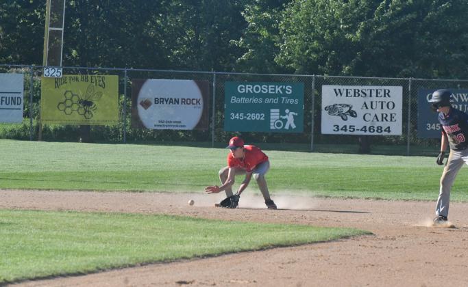 Teeners played in the Webster Round Robin July 11. Here, shortstop Hudson Lesnar can be seen recieving a ground ball and preparing to make an out at first to secure the third out of the inning. Reporter &amp;amp; Farmer | Connor Handrahan