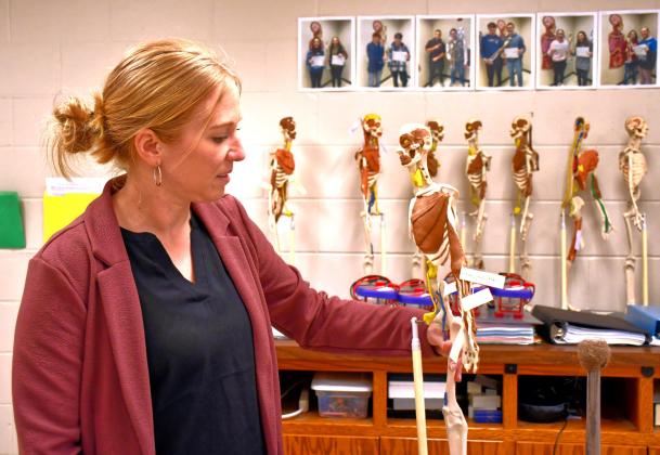 Webster Area High School science teacher Jenna Sinner shows off one of her student’s projects April 28. She has been named the Region 1 Teacher of the Year. Reporter &amp;amp; Farmer | Leyton Beardslee