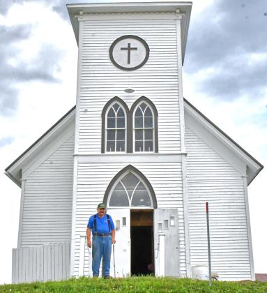 St. Pauli church was moved from Wallace to Webster in 2014 and has been receiving constant attention and care by multiple members of the community. Danny Johnson, pictured, is just one of those proud community members who has put in much of his free time to help restore the building. Reporter &amp;amp; Farmer | Connor Handrahan