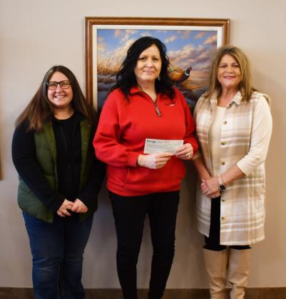 As a part of their December 12 days of giving event which gives back 12 percent of profits to the community, Sioux Valley Coop donated $2,650 to the Day County Community Foundation. The check with the donation was handed to the foundation Feb. 19. Here from left, DCCF member Amanda Dohn stands next to Sioux Valley Coop General Manager Cheryl Premus and fellow DCCF board member Kim Sinner. Reporter &amp;amp; Farmer | Brenner Cariveau