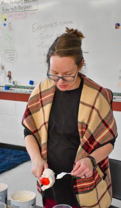 Webster Area counselor Tina Norton scoops ice cream for root beer floats which the eighth grade class chose as their reward for having the highest average attendnce for the month of January. Principal Craig Case said this along with other changes to the rigidity of the school’s attendance policy have contributed to higher average attendance through the school’s first semester compared to last year. Reporter &amp;amp; Farmer | Leyton Beardslee