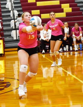 Webster Area Bearcats hosted Tiospa Zina Wamdbi at the armory Oct. 8. The Bearcats won the match in three sets. Here, Katie Braun (13) tracks down the ball and hits it towards her teammates while Allison Case (6) prepares to make a play. Reporter &amp;amp; Farmer | Brenner Cariveau