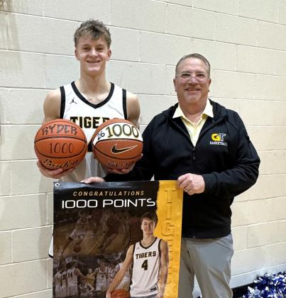 Groton Area senior Ryder Johnson, pictured Jan. 15 with head coach Greg Kjellsen after scoring his 1,000th career varsity point, now has his eyes set on leading the Tigers to a state tournament appearence in his final season. Johnson scored his 1,000th point in an 83-9 victory over Tiospa Zina in a 15 point performance. Reporter &amp;amp; Farmer | Subscriber snapshot